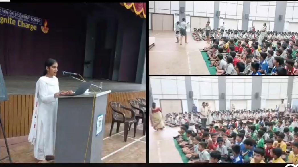 Meha presenting a Learning Through Wonder workshop to a school hall of students