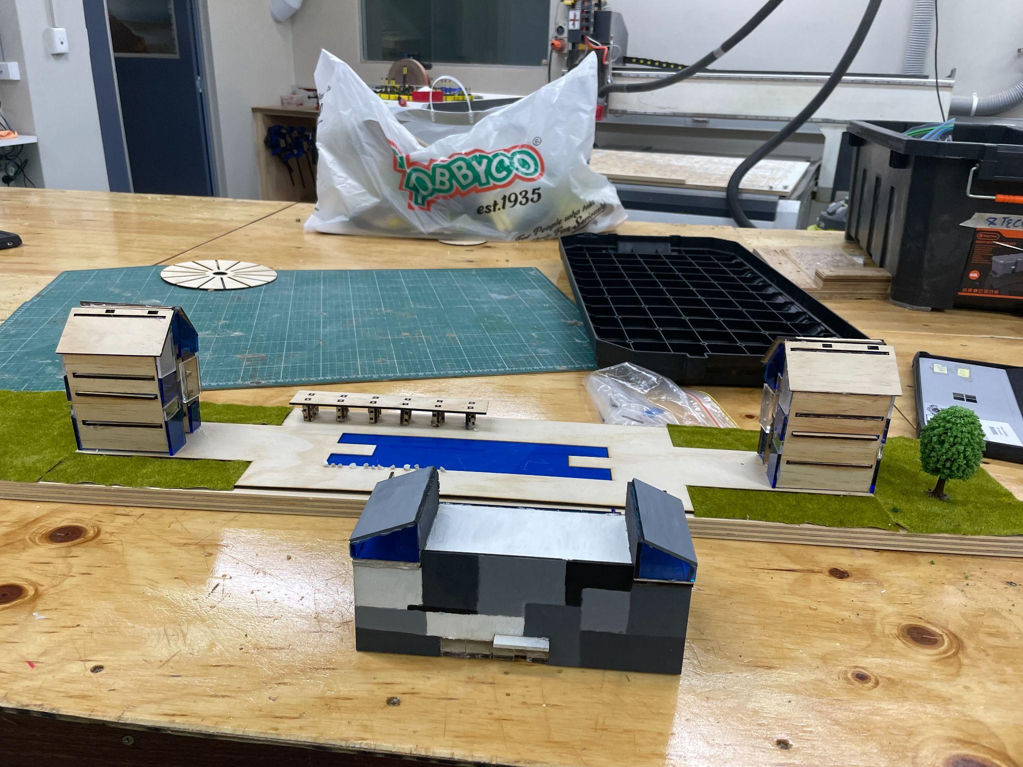 The completed multi-level hotel model in acrylic and plywood